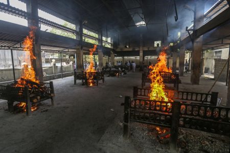 Bodies of Covid victims are burned in funeral pyres