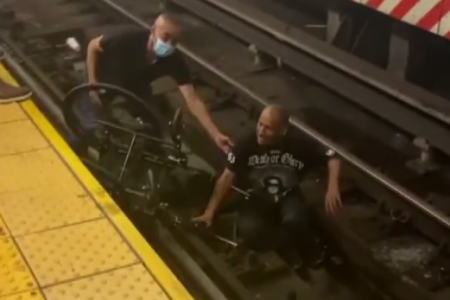 man in wheelchair falls onto the train tracks in NYC, rescued just in time