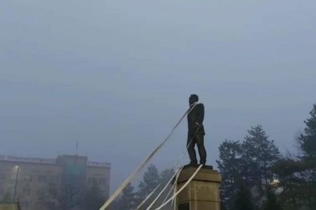 protestors try to topple statue of former kazakh president
