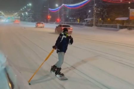A teenager caught after snowboarding on streets in Russia