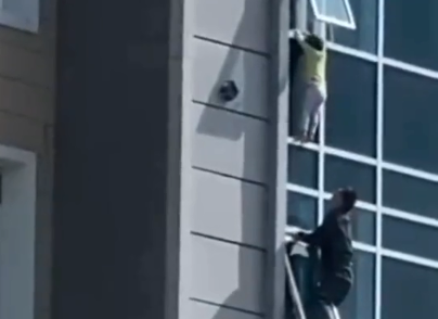moment 3-year-old boy rescued from falling in kazakhstan