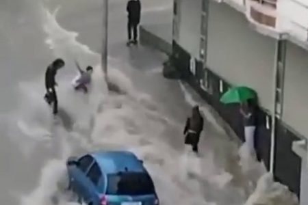 boy dragged by flood waters rescued