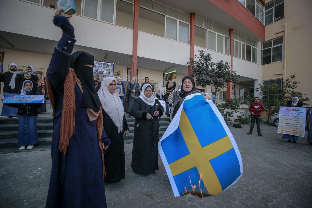 Palestinians in Gaza City protest the burning of a Koran at the Turkish embassy in Sweden