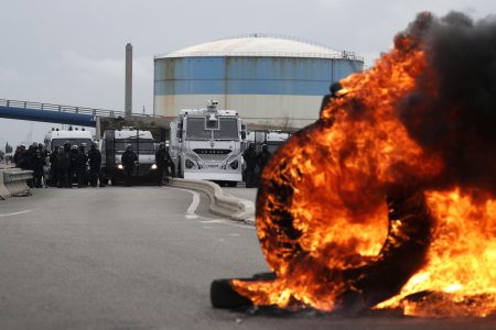 French workers block entrance to refinery to protest pension reform