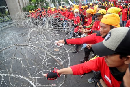 hundreds of workers take to streets in indonesia