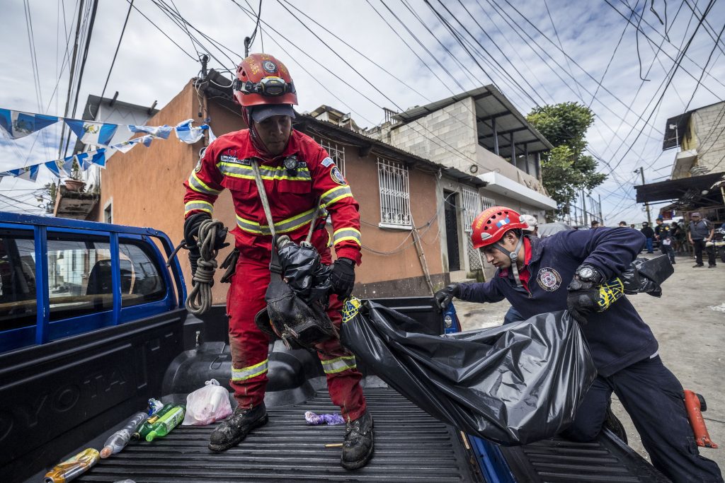 Rescuers search for people missing after a river overflowed in Guatemala City