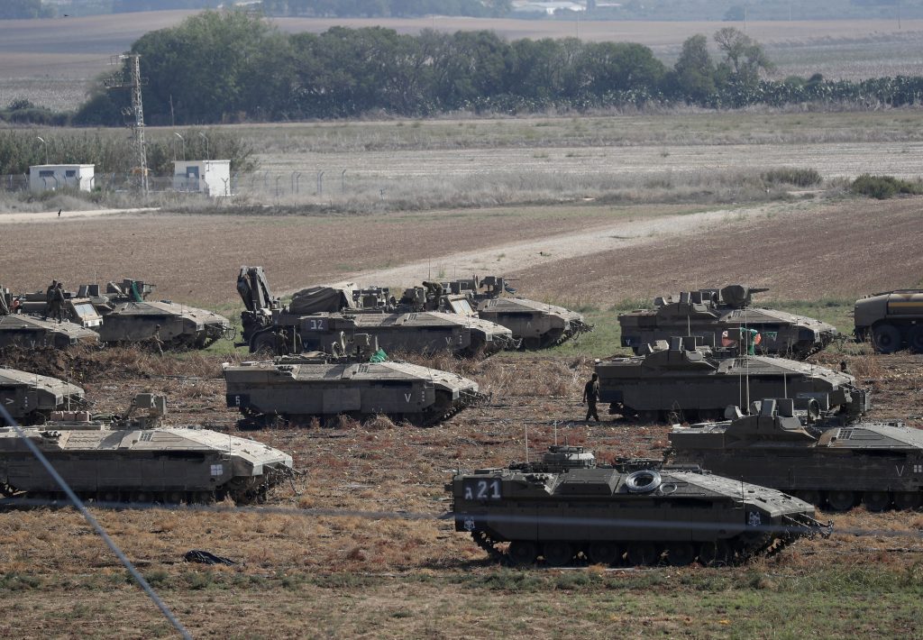 Israeli troops muster near border with Gaza Strip