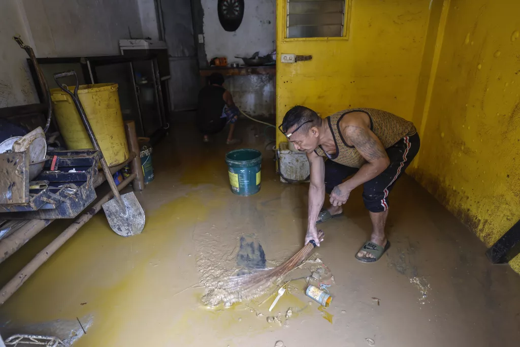 Marikina City residents begin clean-up of their homes after Typhoon Gaemi