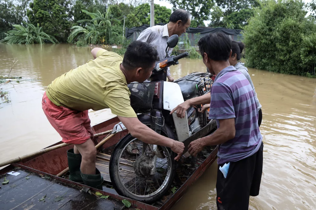 Red River's rapid rising floods riverbank communities triggered by Typhoon Yagi