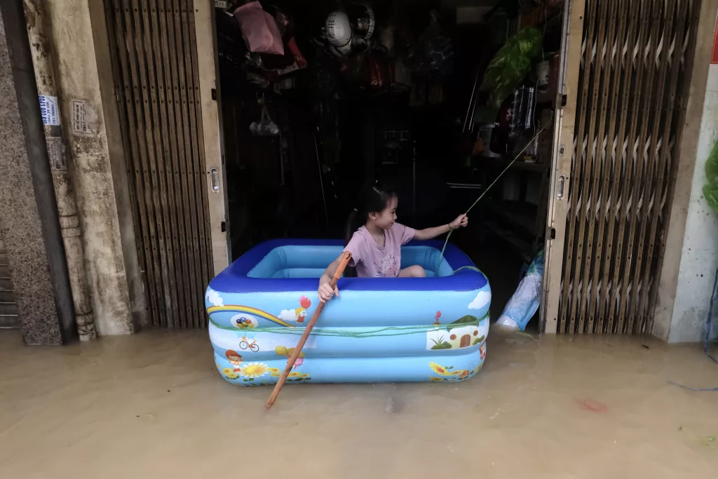Red River overflows causing severe flooding in Hanoi following Typhoon Yagi