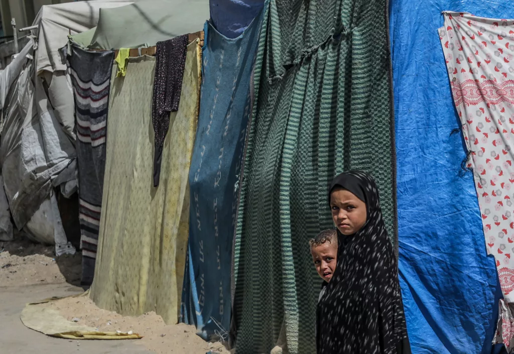 Internally displaced Palestinians, among at least 1.9 million displaced people across the Gaza Strip, shelter in Deir Al-Balah