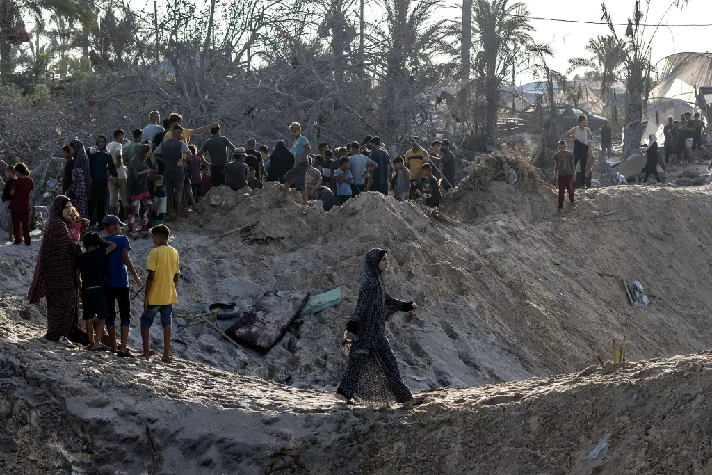 Palestinians search for missing people following Israeli airstrikes on Al-Mawasi humanitarian zone
