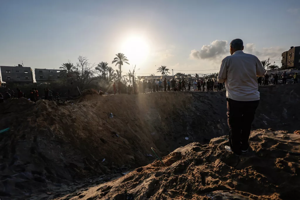 Palestinians search for missing people following Israeli airstrikes on Al-Mawasi humanitarian zone