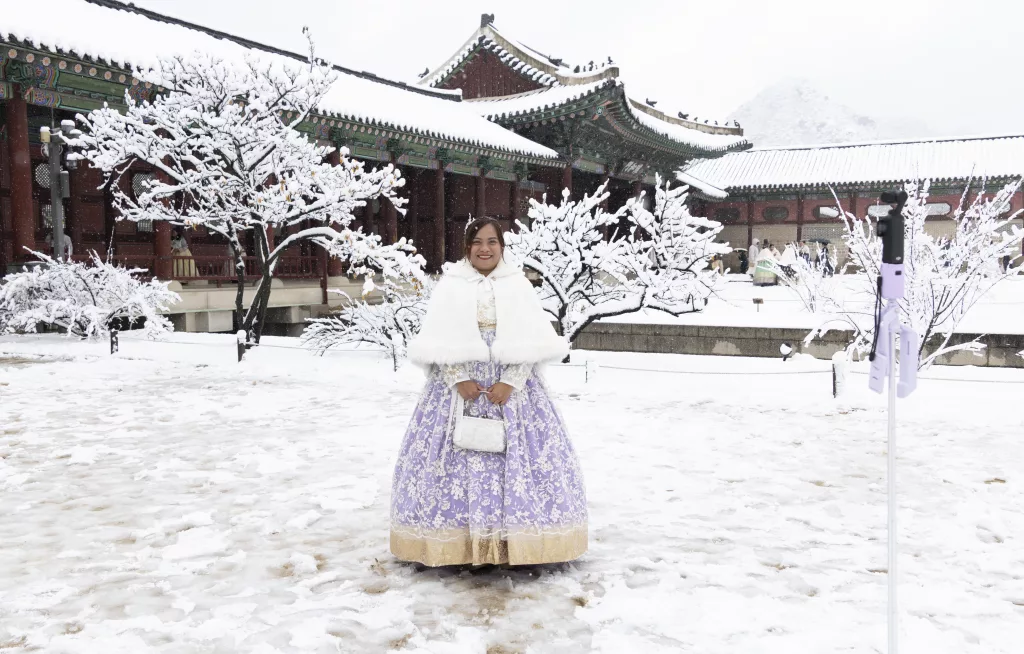 People visit Gyeongbokgung Palace amid heavy snowfall in Seoul
