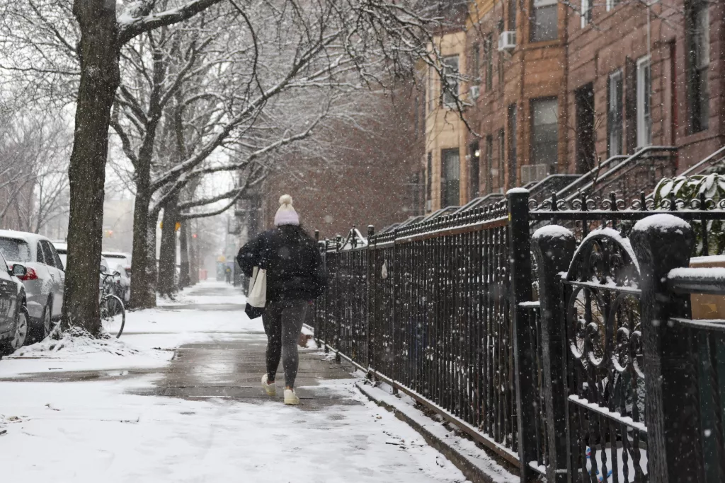 Snow accumulates in NYC as major winter storm hits US