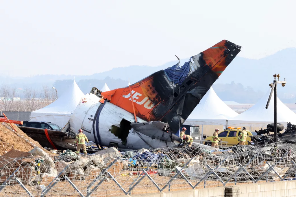 Authorities continue to work at the site of Jeju Air plane crash in Muan, South Korea