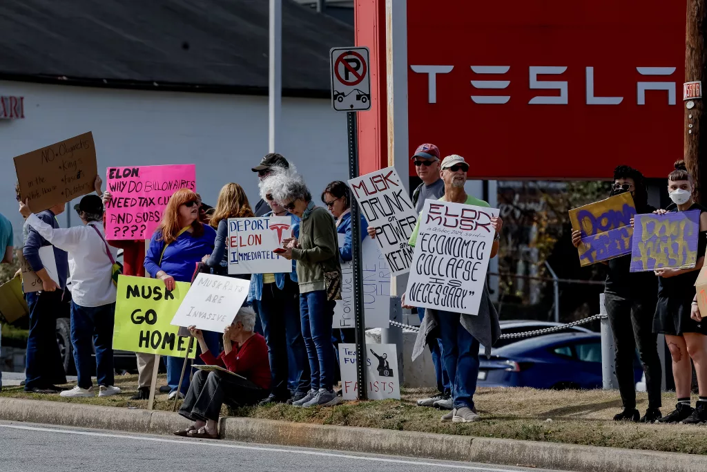 Protest outside Tesla dealership in Decatur, Georgia over Musk's government role